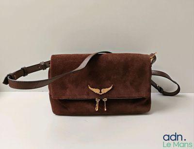 sac à bandoulière marron à motifs, orné d'un oiseau en métal doré sur le devant