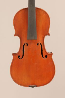 an old violin with a bow hanging from the back