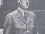 an old black and white photo of a man in a military uniform