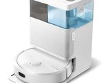 un distributeur d'eau blanc et bleu posé sur un plan de travail blanc