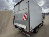 a white box truck parked in a parking lot