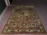 rug on the floor in front of a doorway with a door in the background