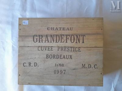 a wooden box with a label on it that says chateau grandefort