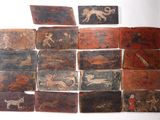 many pieces of art on the wall of this room