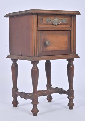 a small wooden table with a drawer on top of it