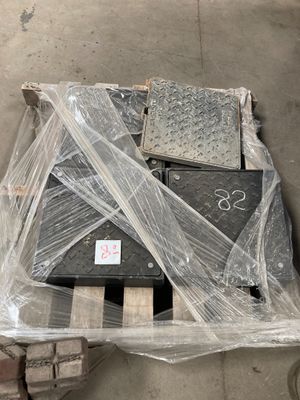 a pile of electronic equipment wrapped in plastic on a pallet