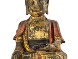 an image of a statue of a person sitting in a lotus pose