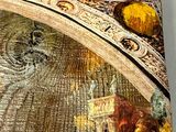 a close up of a painting on the wall of a building