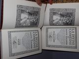 a person holding a book open to show it ' s contents