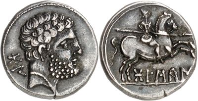 a close up of a silver coin with a horse and rider on it