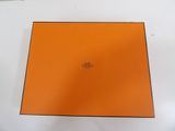 an orange box sitting on top of a white table