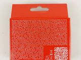 a close up of a red box with a qr code on it