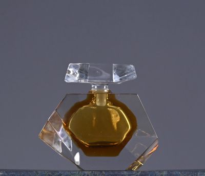 a bottle of perfume sitting on top of a table