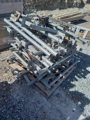 a pile of metal pipes sitting on a pallet