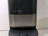 a black and silver coffee maker sitting on top of a white counter
