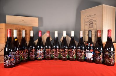 several bottles of wine are lined up on a table