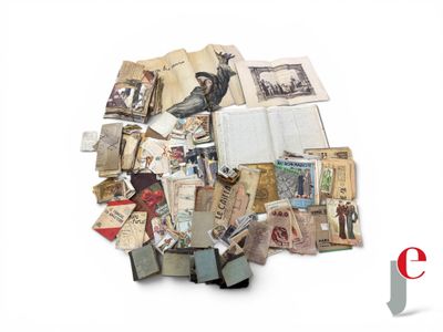 a pile of old books and papers on a white surface
