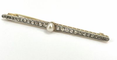 an image of a pearl and diamond hair clip on a white background