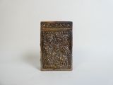 an antique silver box with a floral design on the front