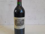 a bottle of wine that is sitting on a table