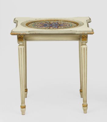 a white table with a blue and gold design on the top