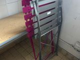a bunk bed in the corner of a bathroom with a ladder