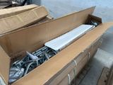 a cardboard box with a bunch of screws inside of it