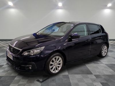 a picture of a black car parked in a garage