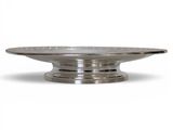 a close up of a silver plate on a white background