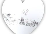 a heart shaped mirror with the word love written on it