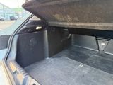 a trunk of a car that has a box in the trunk