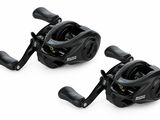 a pair of black fishing reels on a white background