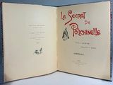 an open book with a picture of a penguin on it