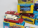 several toy cars are stacked on top of each other on a table