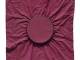 purple cloth with a round object on it