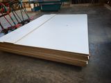 a close up of a stack of white sheets of paper on a floor