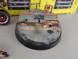 a toy car and a toy truck on a table