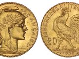 une pièce d'or sur laquelle figurent une femme et un coq