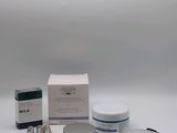 the contents of a skin care kit are laid out on a white surface