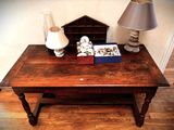 a small table with a lamp and a book on it