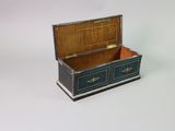 a small wooden box with two drawers inside of it