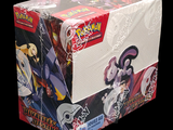 a box of pokemon trading cards on a black background