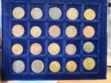 a blue box with a lot of coins in it