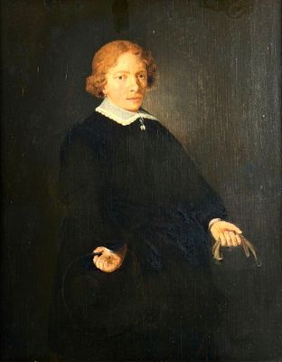 portrait of a young man in a black dress with a white collar