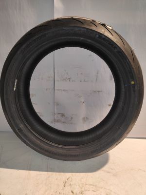 a close up of a tire tire on a white surface