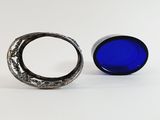 two rings sitting next to each other on a white surface