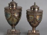 pair of antique silverplated urns with lids on stands