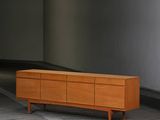 an image of an empty room with a wooden dresser