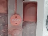 a box with three bottles of baby bottles in it