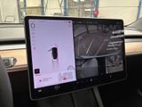 a tablet that is sitting in a car with a camera on it